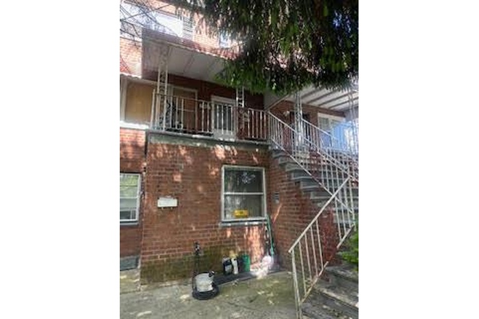 View of property featuring stairway
