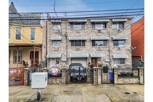 This exquisite three family home is a rare find in a peaceful, friendly neighborhood.