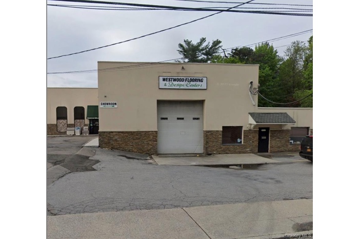 View of property featuring a garage