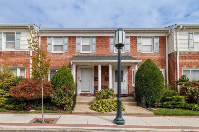 View of front of house with brick siding