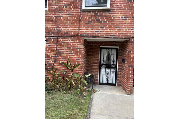 Property entrance with brick siding