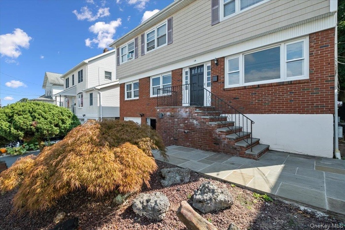 Colonial house with brick siding