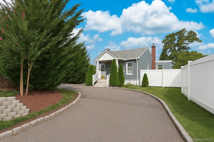 View of front of home featuring a chimney