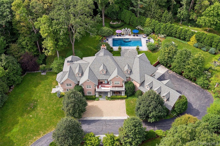 View of subject property featuring a pool area