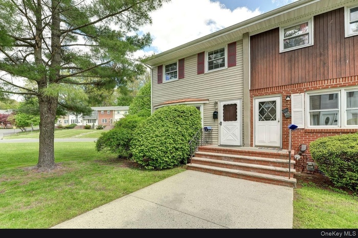 View of front of house featuring a front lawn