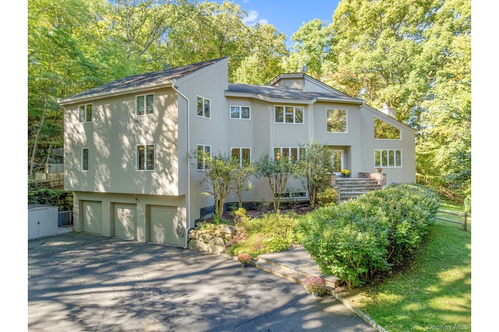 Welcome to 13 Kingdom Ridge Road with Byram Hills Schools privately set on 3.41 acres in a cul-de-sac.