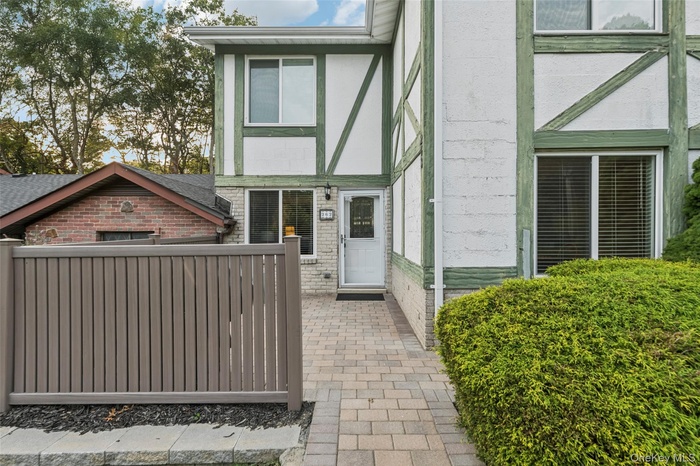 Entrance to property featuring brick siding