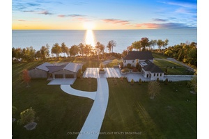 Indulge in luxury at this 13 acre Lake Huron estate, where meticulous craftsmanship and attention to detail converge to create an unparalleled retreat.