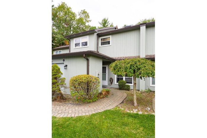 View of front of property with a front yard