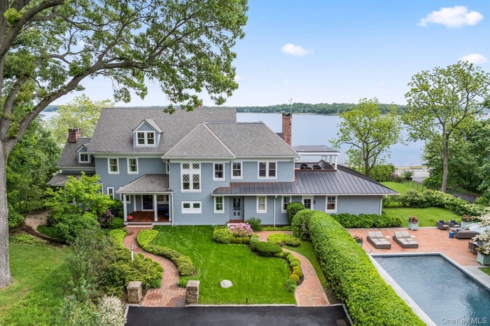 Front of home and pool with tranquil views of the Harbor.