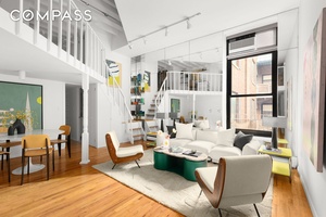 An expansive duplex loft offering one bedroom and one and a half bathrooms, with striking proportions, soaring ceilings, and a distinctive layout in a full service Greenwich Village building on ...