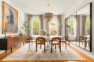 A sun filled four bedroom, two bathroom home with three exposures, lush treetop views, and an ideal layout awaits in the heart of Cobble Hill.