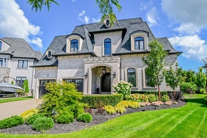 Welcome to this stunning custom built two story residence, offering over 6, 000 sq.
