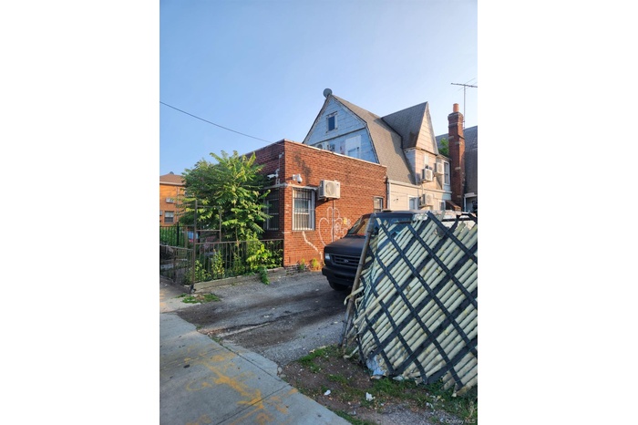 View of property exterior featuring brick siding