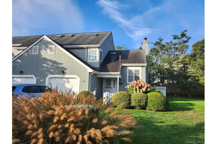 View of front facade and attached garage