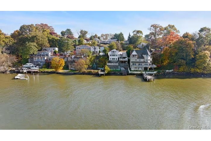 Aerial view of residential area with a nearby body of water