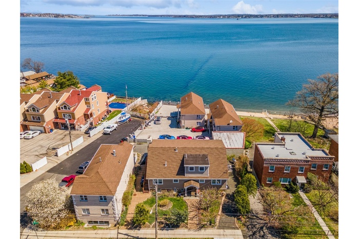 Aerial view with a water view and a residential view