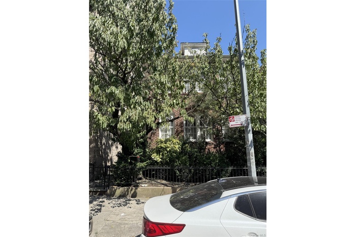 Exterior view of a fenced front yard