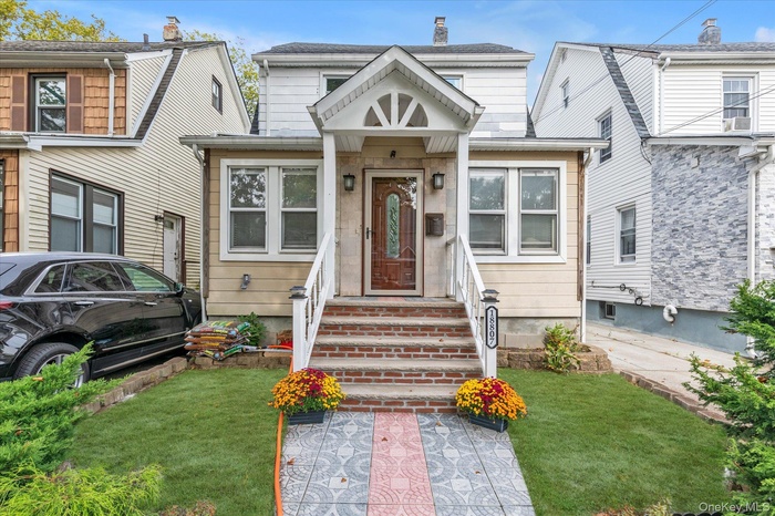 Bungalow-style house with a front lawn and a chimney