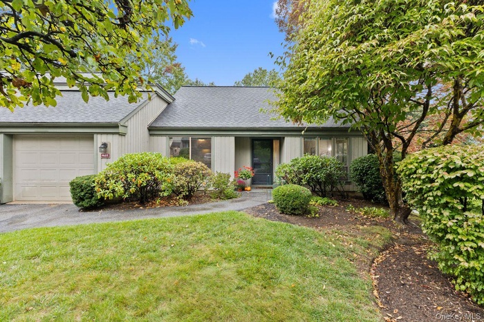 End unit one-level living with a garage