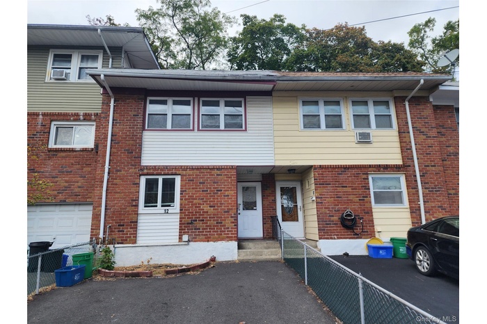 Traditional-style house featuring brick siding