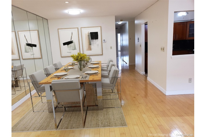 Dining space featuring light wood-style floors and baseboards