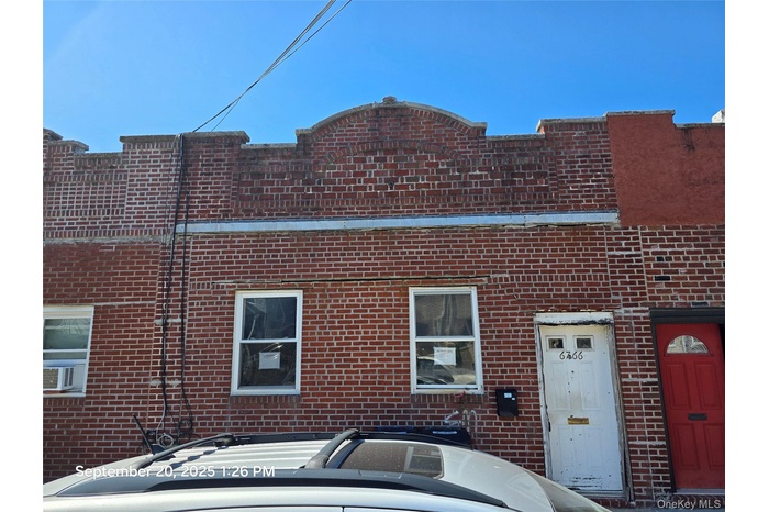 View of front of house with brick siding