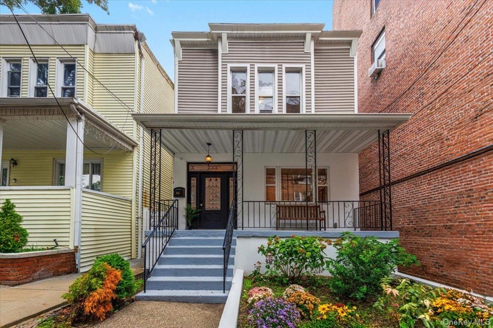 View of front of house featuring covered porch
