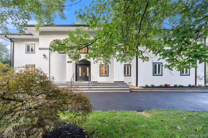 View of front of home with stucco siding