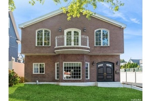 Stunning All Brick Colonial, Few Blocks from the Bay, Located on a Quiet Street in the Bayside Estates Section.