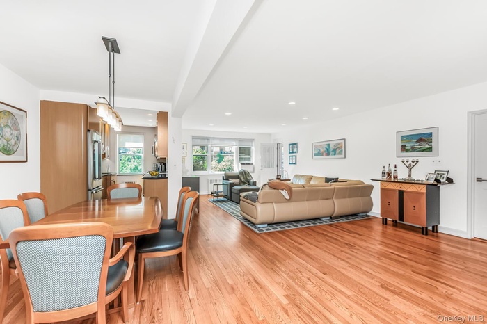 Dining room featuring light wood-style flooring and recessed lighting