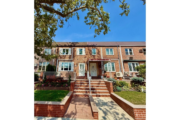 View of front of property featuring brick siding