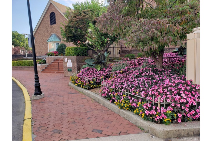 View of property's community featuring stairs