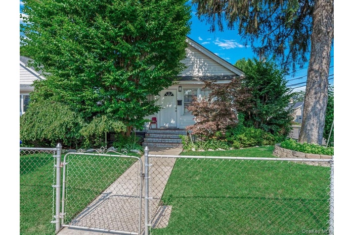 Obstructed view of property featuring a gate