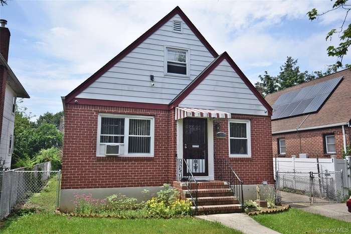 View of front of house with brick siding