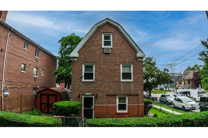 Back of house with brick siding