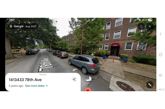 View of asphalt street featuring sidewalks and curbs