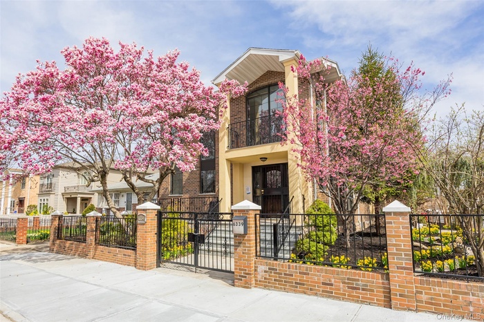 View of property featuring a fenced front yard