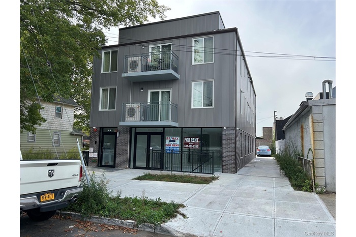 View of front of house with brick siding