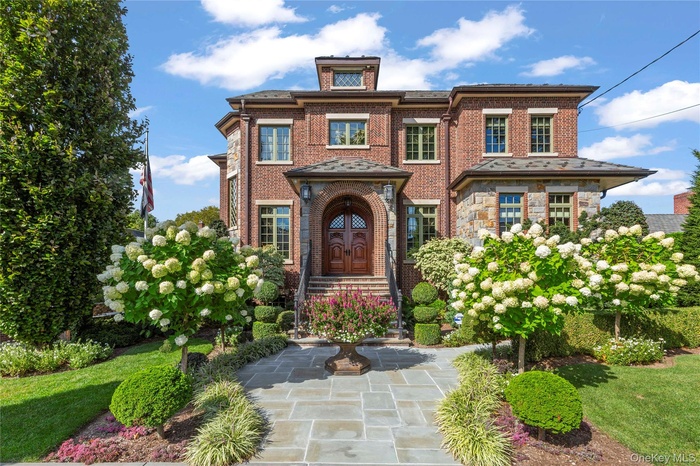 View of front of property featuring brick siding
