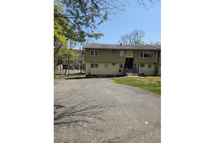 Split foyer home with roof with shingles