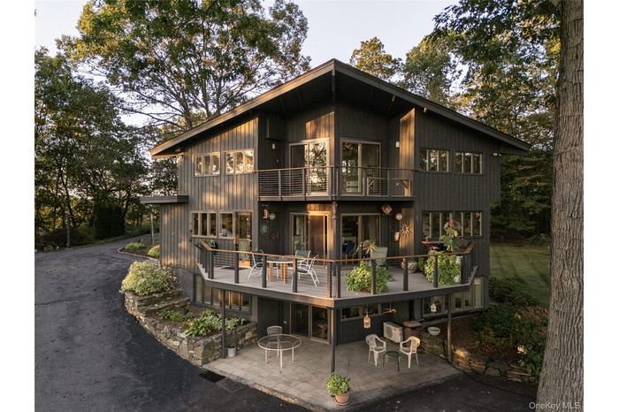 Front of structure showing architectural details and outdoor living spaces on every level