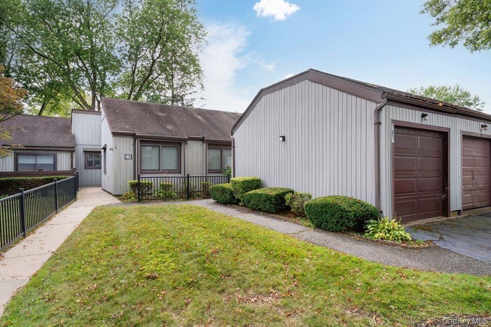 View of front of property with a garage