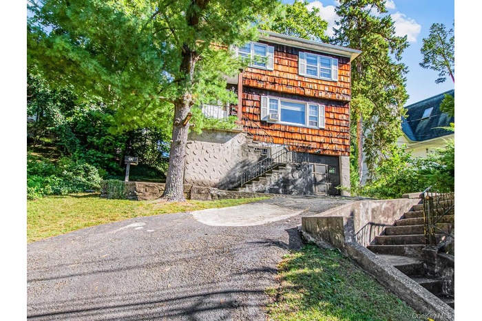 View of front of home featuring stairway