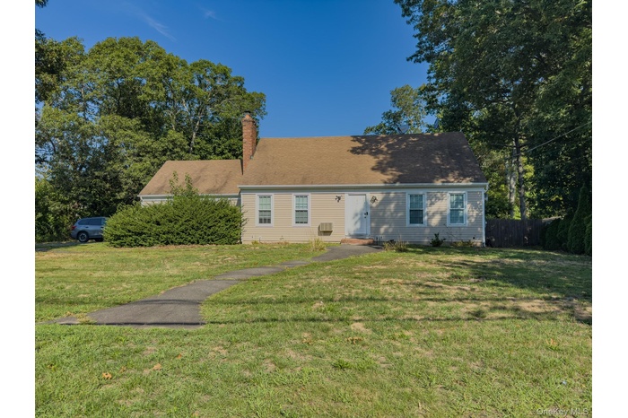 Cape cod-style house with a chimney