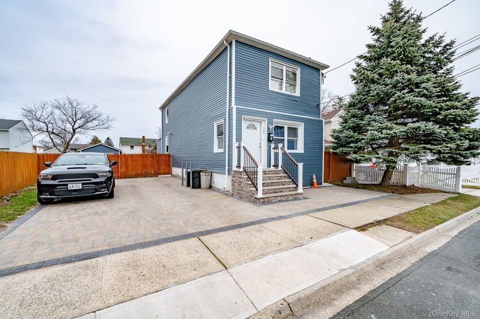 View of front of home featuring driveway
