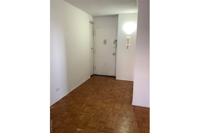 Hallway featuring baseboards