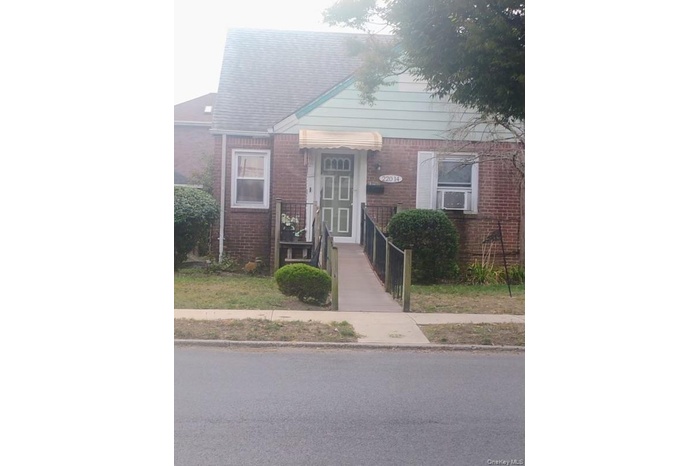 View of front of home with brick siding