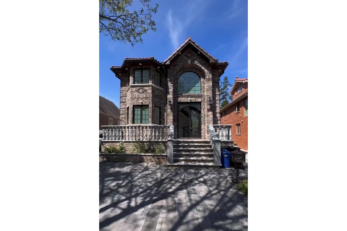 View of front of house with brick siding