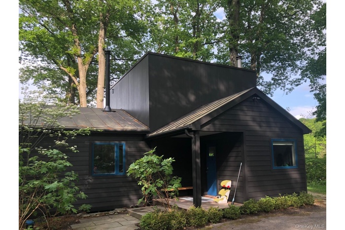 View of front facade featuring a metal roof